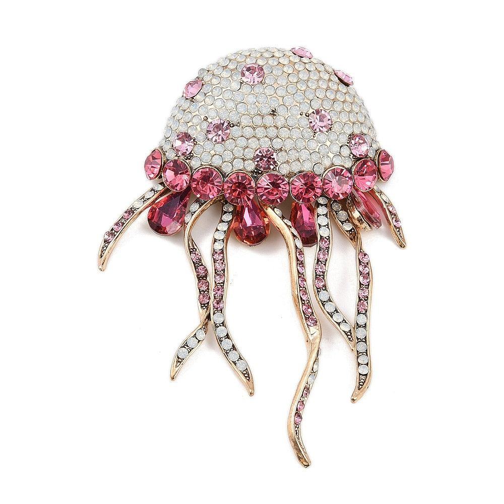 Broche medusa cristal rosa tentáculos móviles - vista frontal fondo blanco