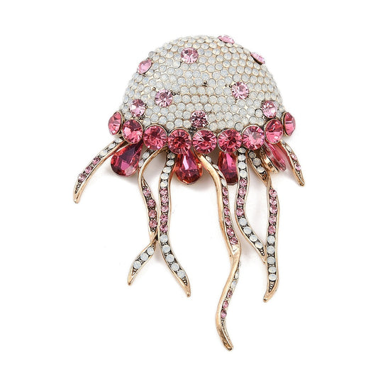 Broche medusa cristal rosa tentáculos móviles - vista frontal fondo blanco