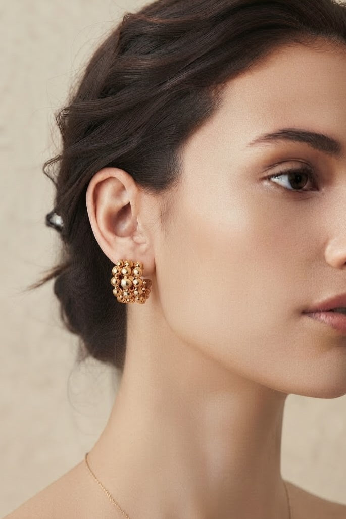 Aros bolas acero dorado puestos modelo