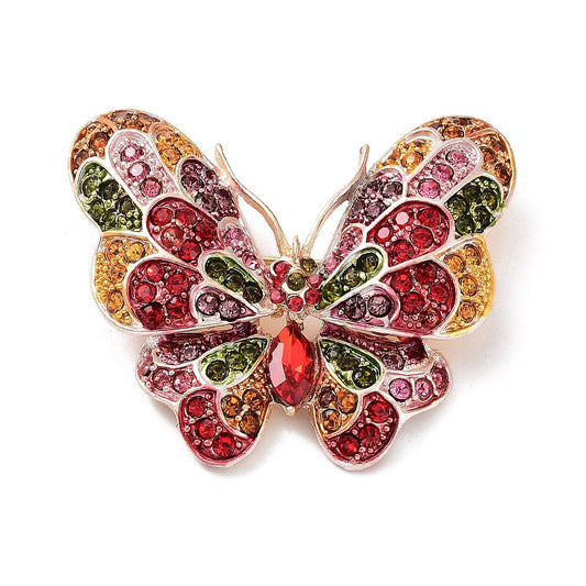 Broche mariposa cristales multicolor sobre fondo blanco