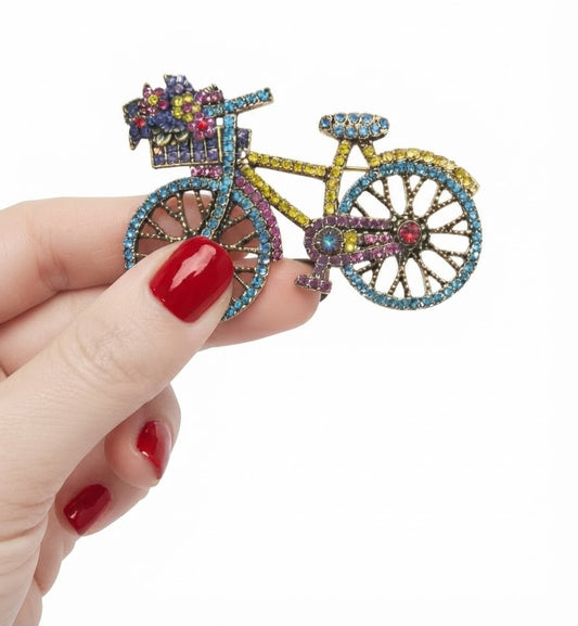 Broche bicicleta cristales turquesa y amarillo - escala en mano