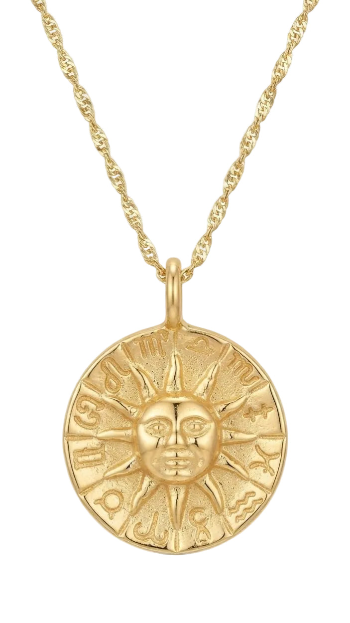 Detalle medalla sol zodiaco grabada en oro