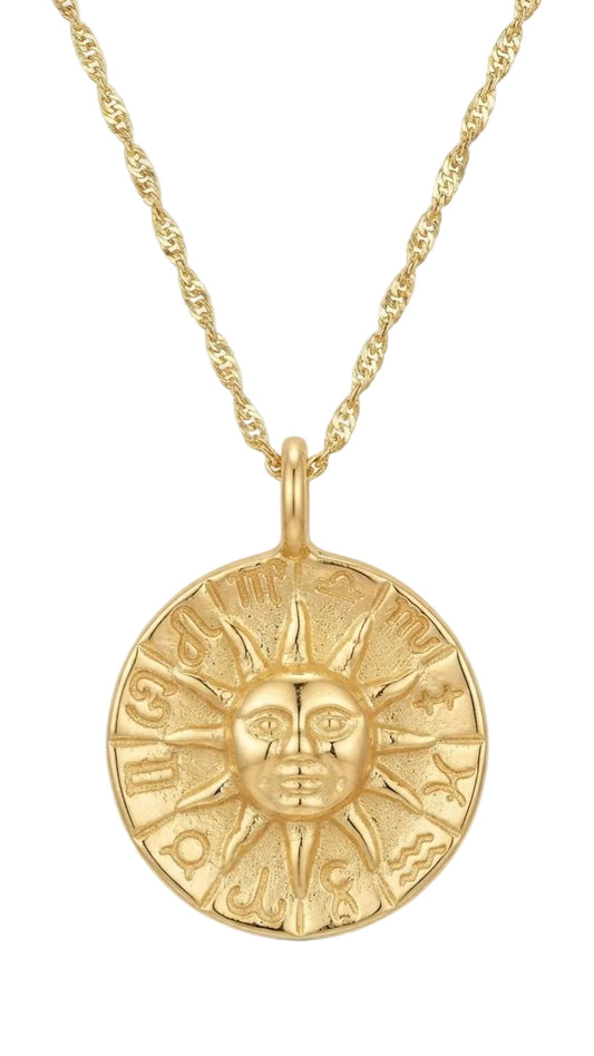 Detalle medalla sol zodiaco grabada en oro